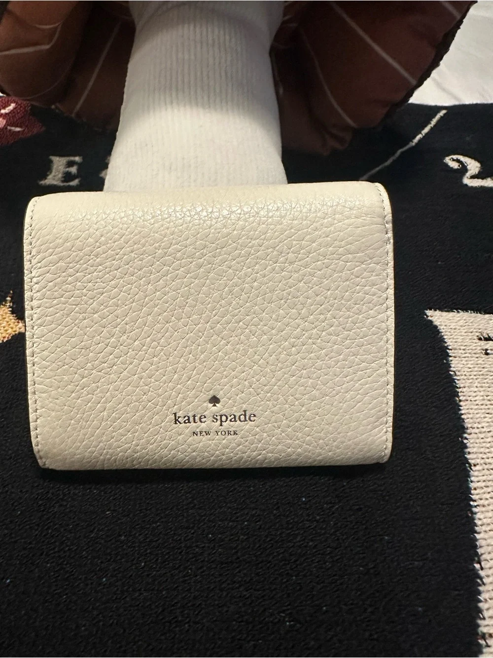 kate spade cream pebbled leather small zip wallet with gold spade emblem